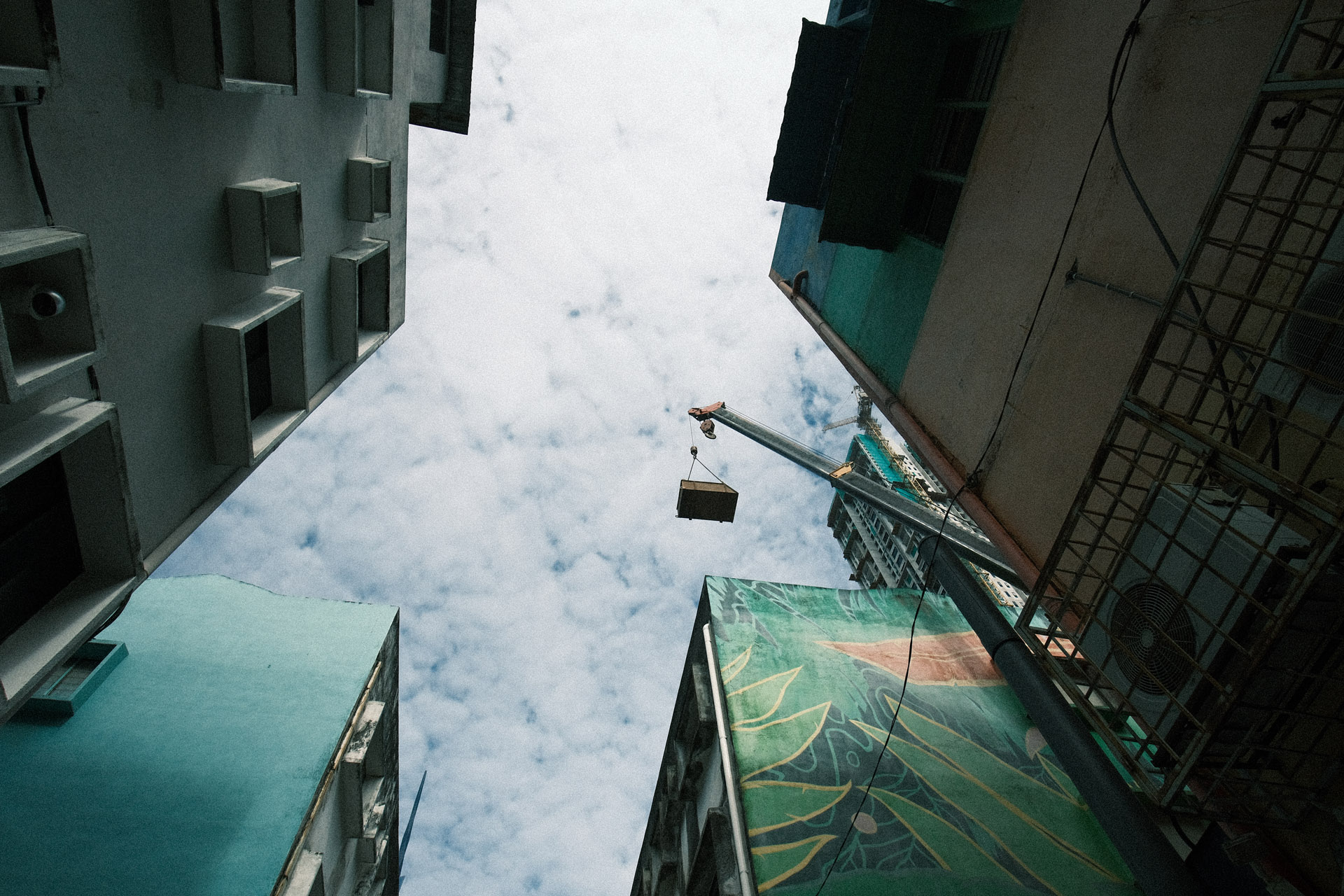 Wide angle of buildings with wall art in Pudu - Natura Classic Film - Classic Negative