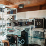 Film Camera Accessories - Film camera on display in glass