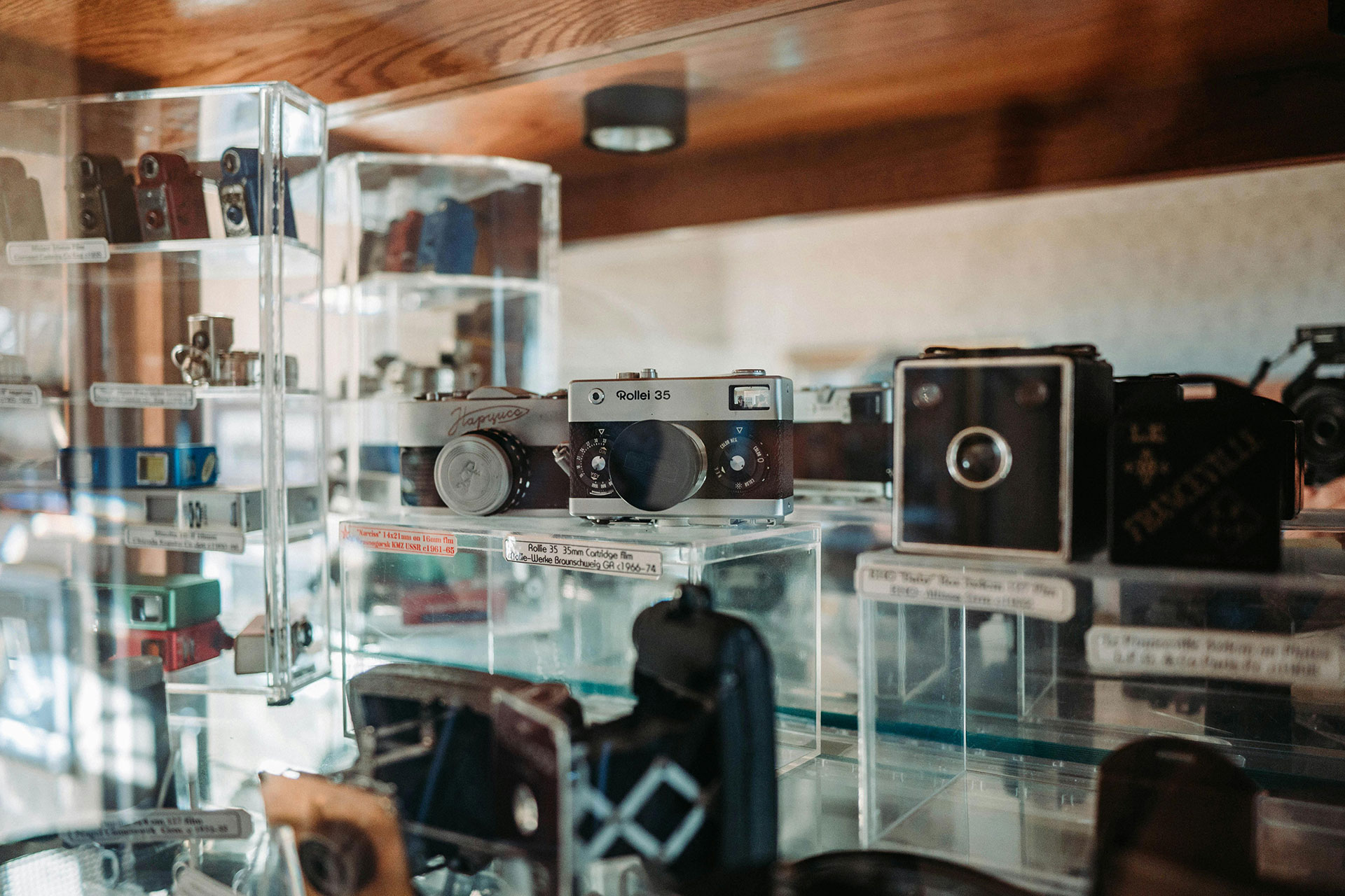 Film Camera Accessories - Film camera on display in glass